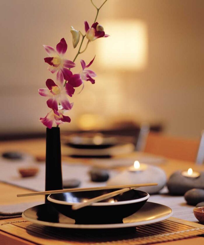 Jana Montgomery and Claudio Santini wield a soft touch within the hard edges of their modern home. Setting the table with the elegant Sasaki dishes, for example, transforms the simplest fare (even Chinese takeout) into an idyllic meal.